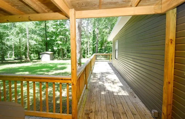 a view of balcony with wooden floor and outdoor space