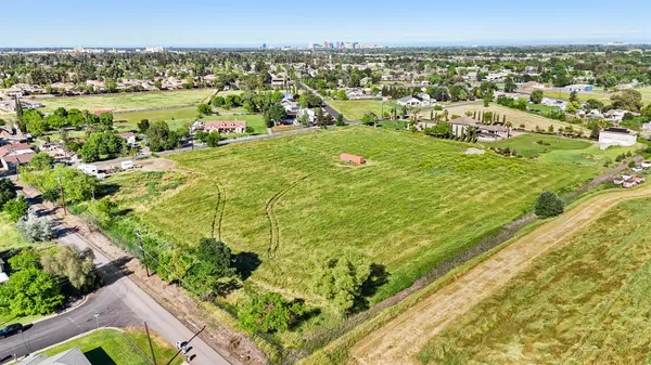 a view of a field with an trees