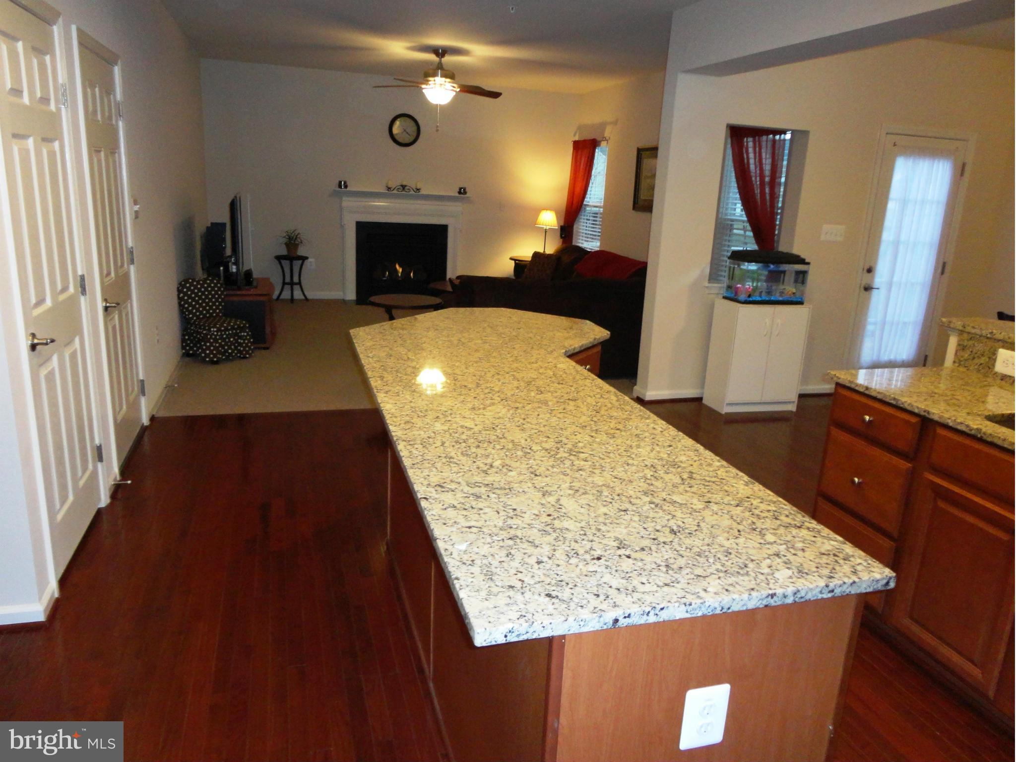 14302 Lusby Ridge Road Accokeek, MD 20607 - Photo 17 of 30 Kitchen Island and Family Room View
