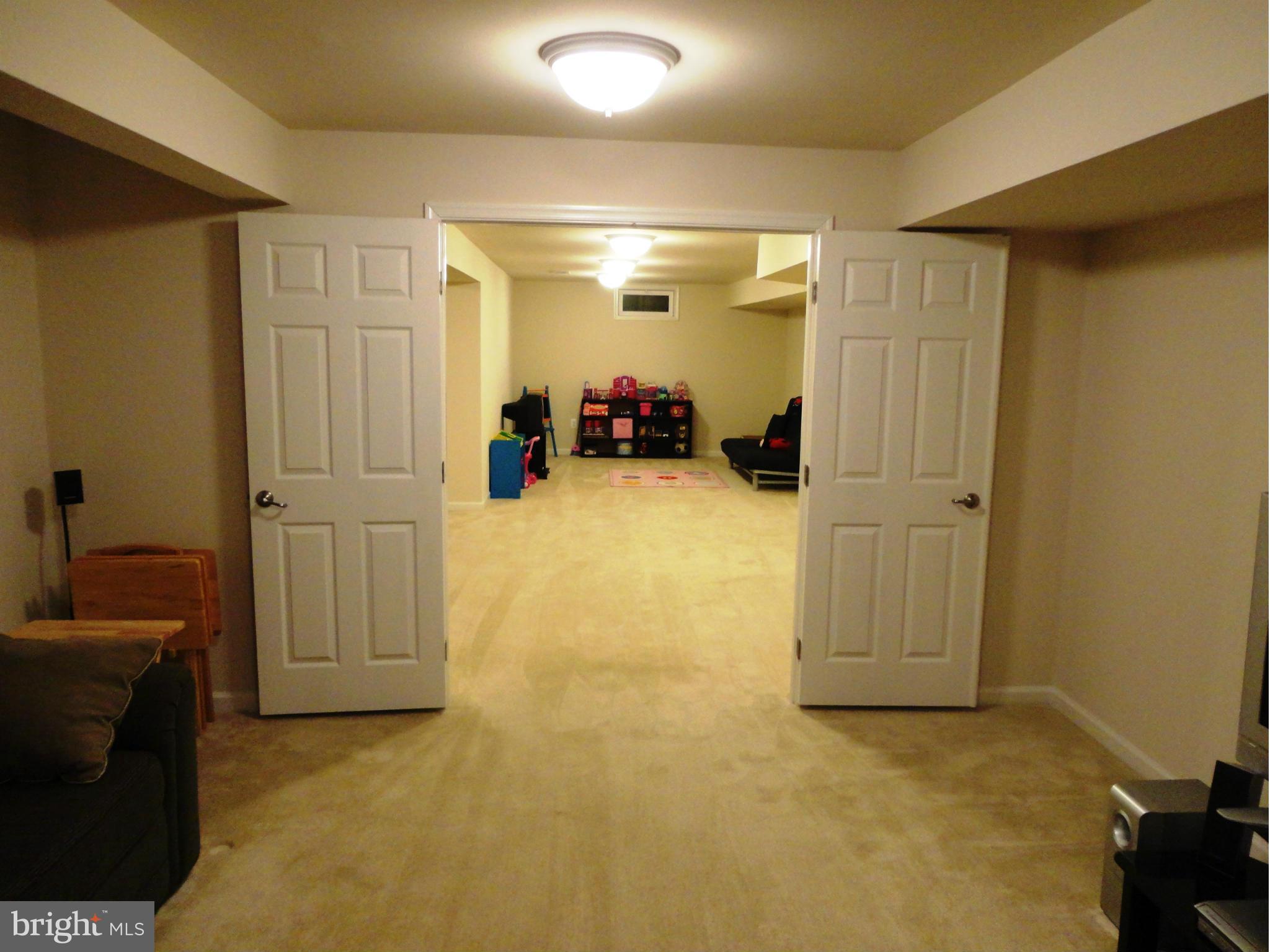 14302 Lusby Ridge Road Accokeek, MD 20607 - Photo 28 of 30 Full Lower Level from Media to Rec Rooms
