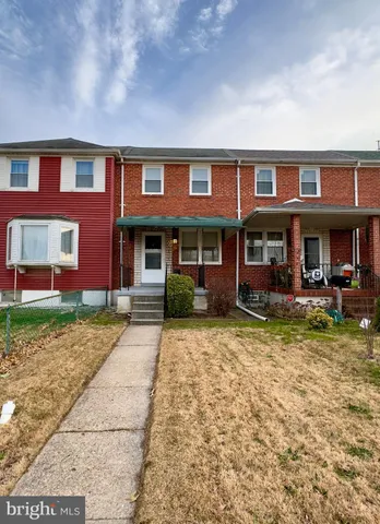 a backyard of a house with yard fire pit and outdoor seating