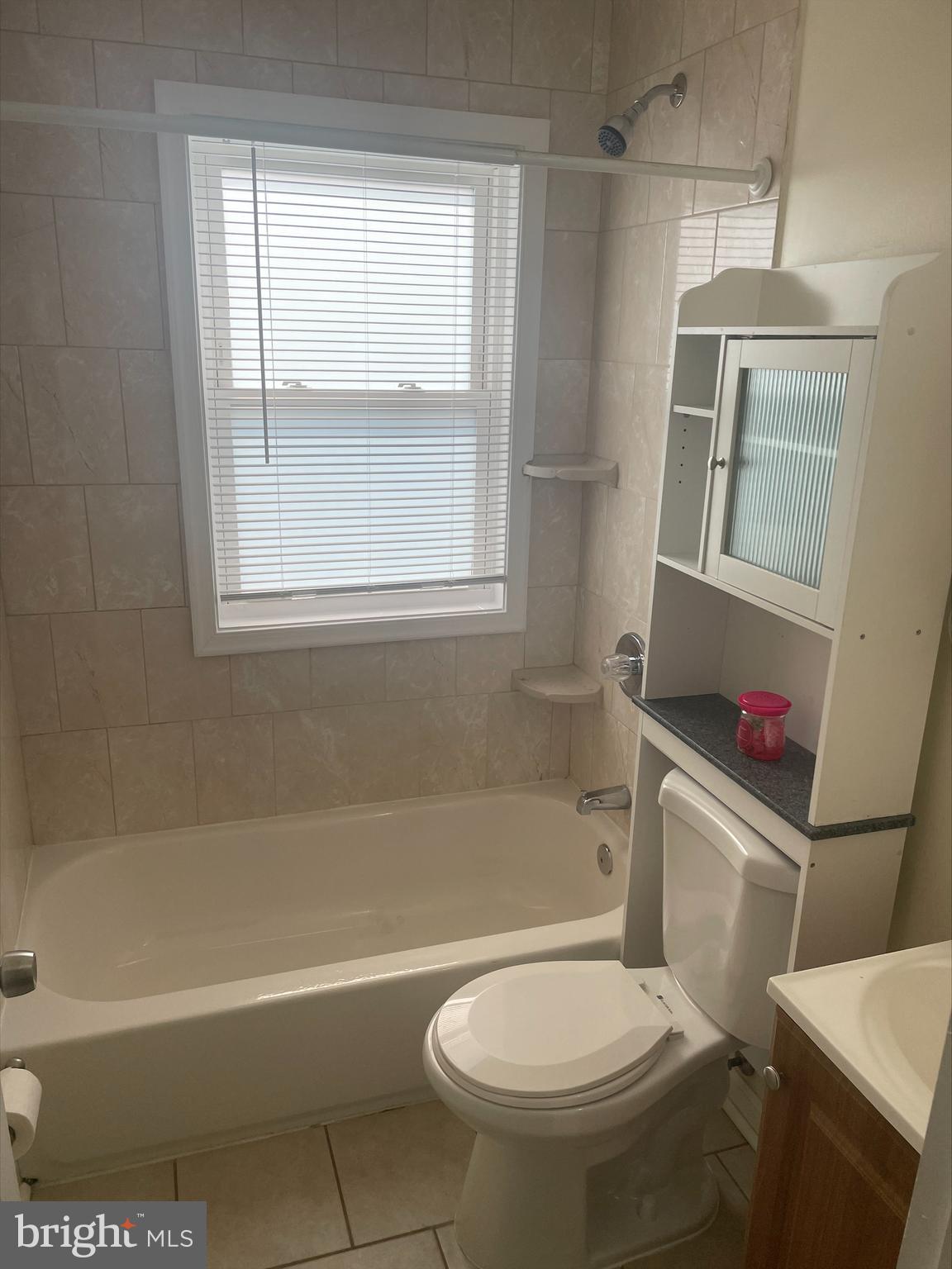 429 Oakwood Road Dundalk, MD 21222 - Photo 11 of 27 a white toilet sitting next to a bath tub and a shower