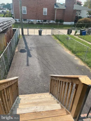 a view of swimming pool with outdoor seating and yard