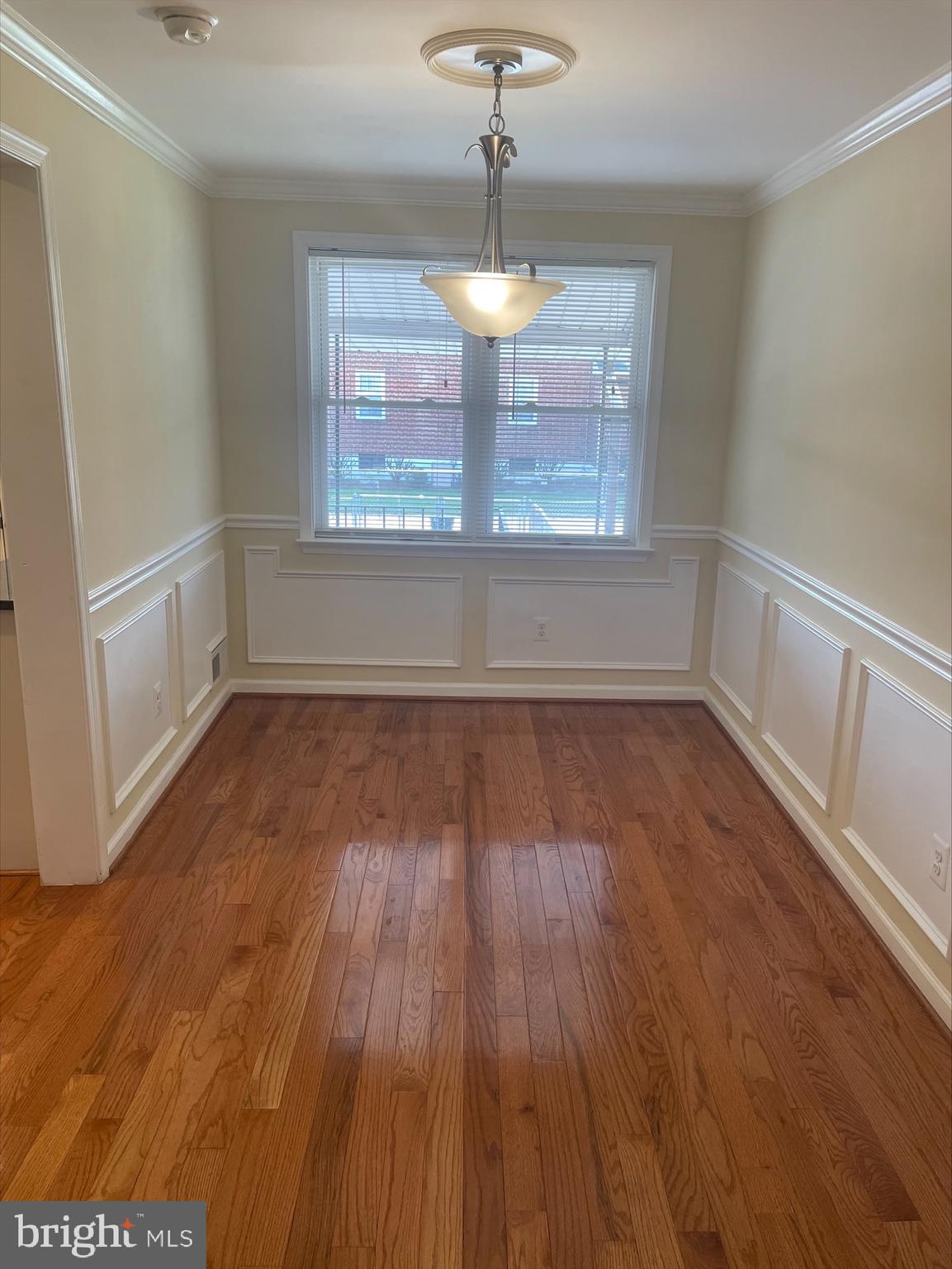 429 Oakwood Road Dundalk, MD 21222 - Photo 22 of 27 wooden floor in an empty room with a window