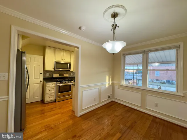 a view of a kitchen from the hallway