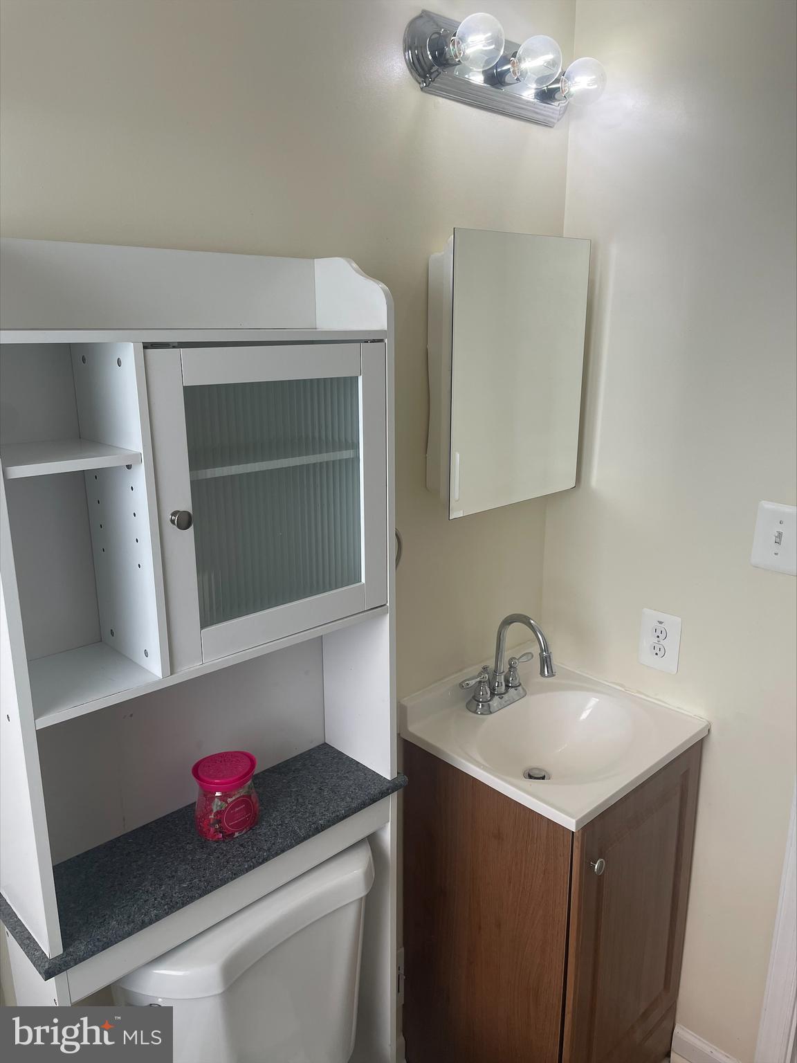 429 Oakwood Road Dundalk, MD 21222 - Photo 10 of 27 a bathroom with a sink vanity and mirror