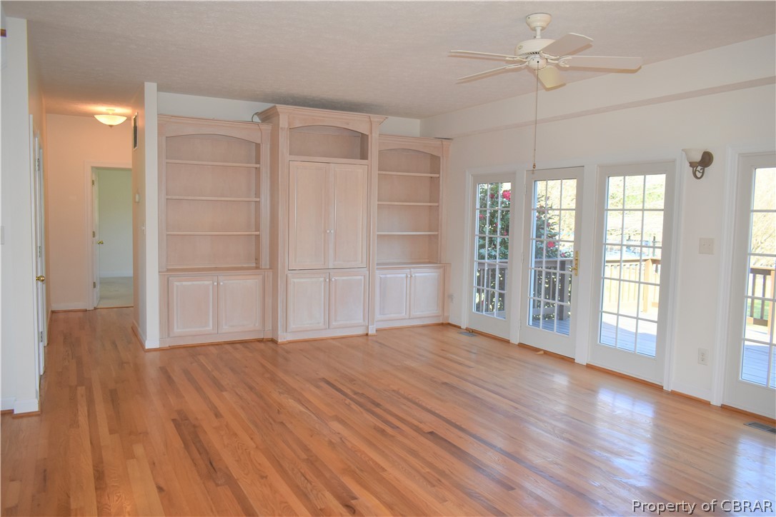 163 Mill Lane Road Cardinal, VA 23025 - Photo 17 of 50 a view of an empty room with a window and wooden floor