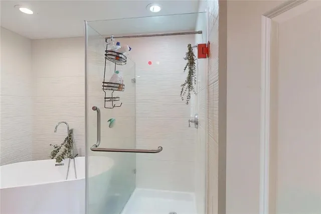 a bathroom with a shower and a sink