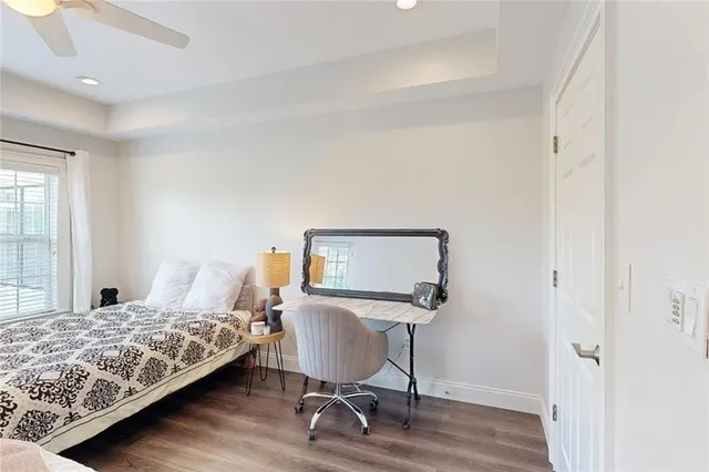 a bedroom with a bed chair and a window