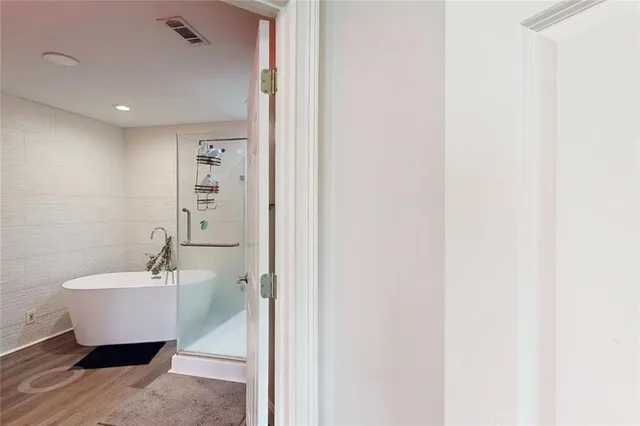 a view of a hallway with a closet and a room