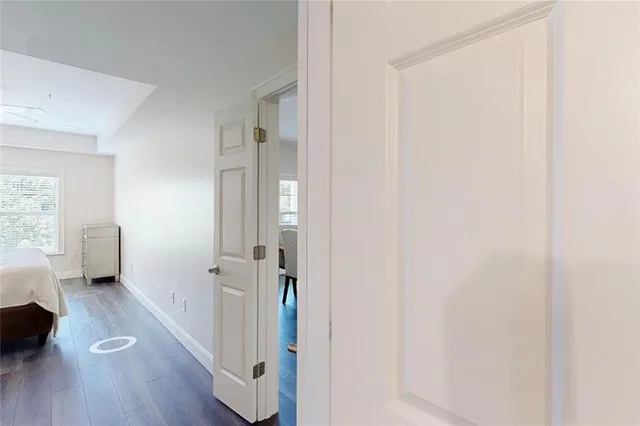 a view of a kitchen with furniture and wooden floor