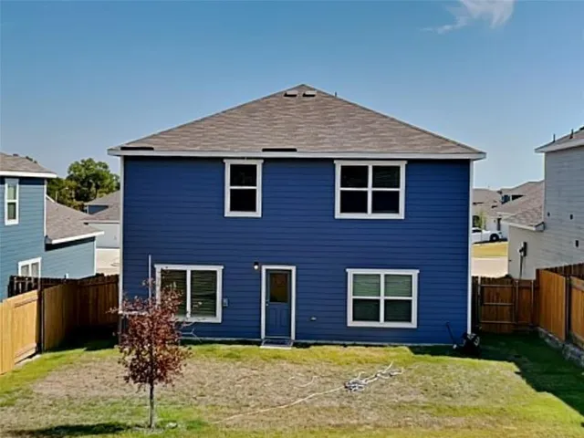 a front view of brick house with yard