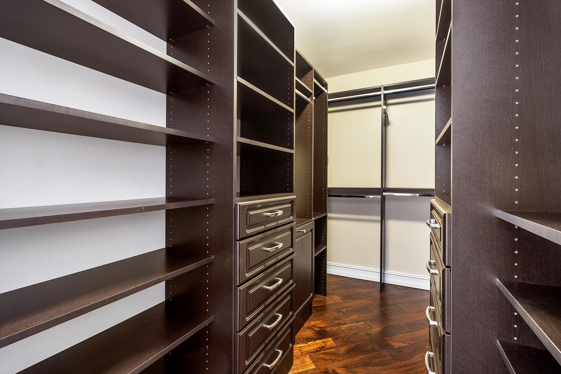 2530 Northwest 40th Street Boca Raton, FL 33434 - Photo 13 of 35 a view of walk in closet with empty racks