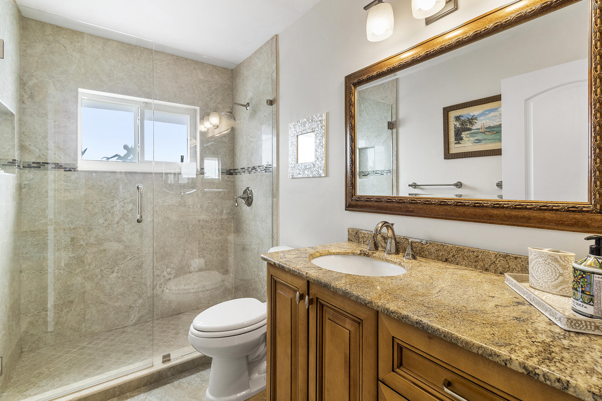 2530 Northwest 40th Street Boca Raton, FL 33434 - Photo 20 of 35 a bathroom with a granite countertop sink a toilet and shower