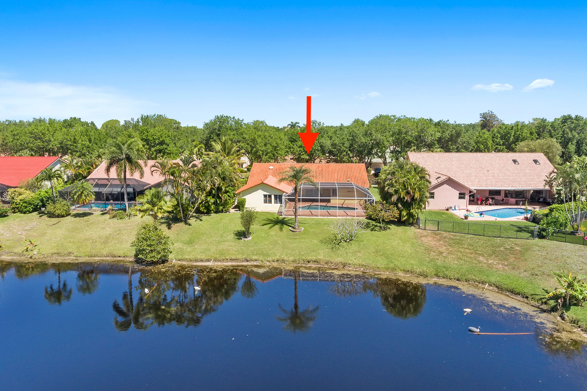 2530 Northwest 40th Street Boca Raton, FL 33434 - Photo 2 of 35 an aerial view of residential houses with outdoor space and swimming pool