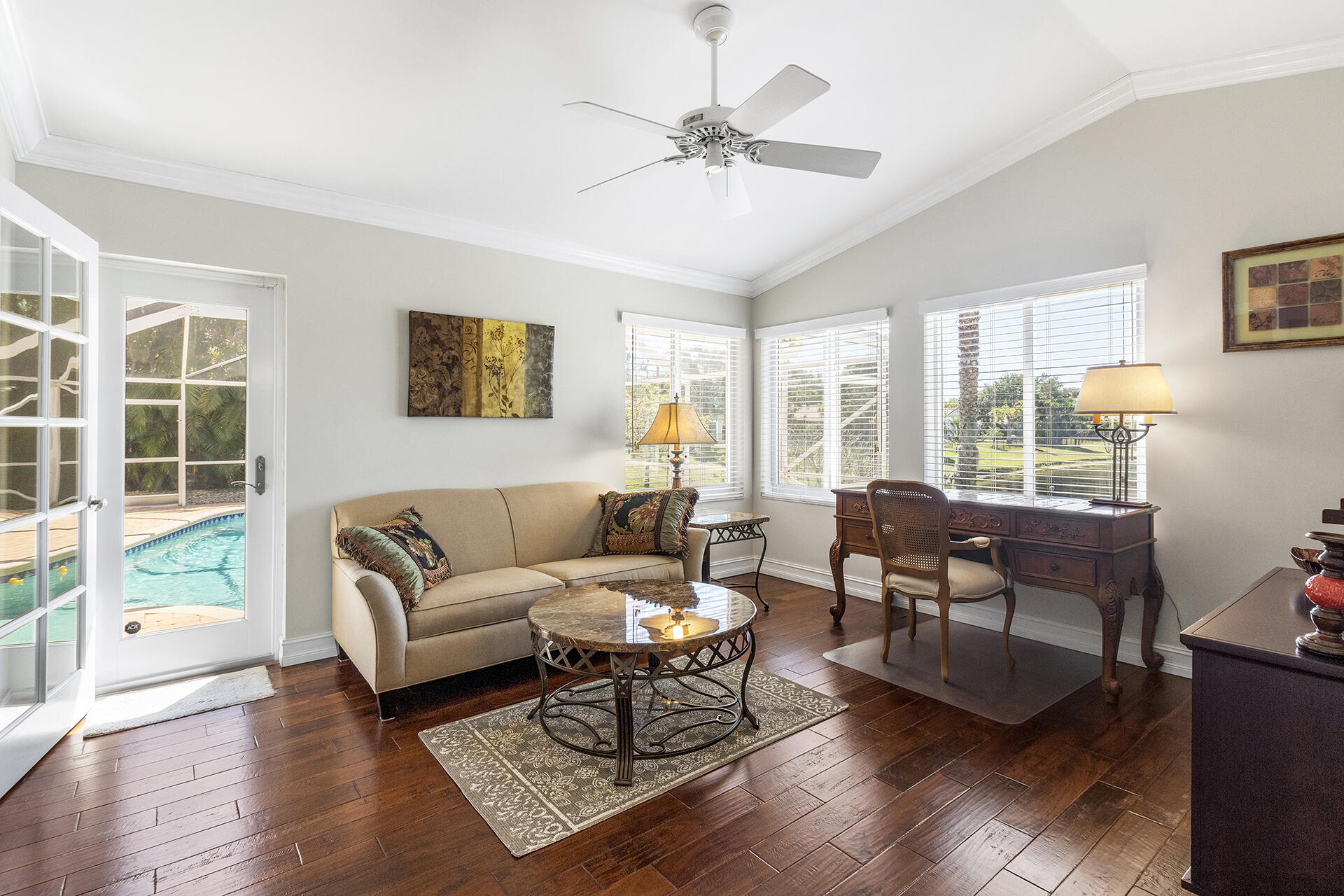 2530 Northwest 40th Street Boca Raton, FL 33434 - Photo 21 of 35 a living room with furniture a large window and wooden floor