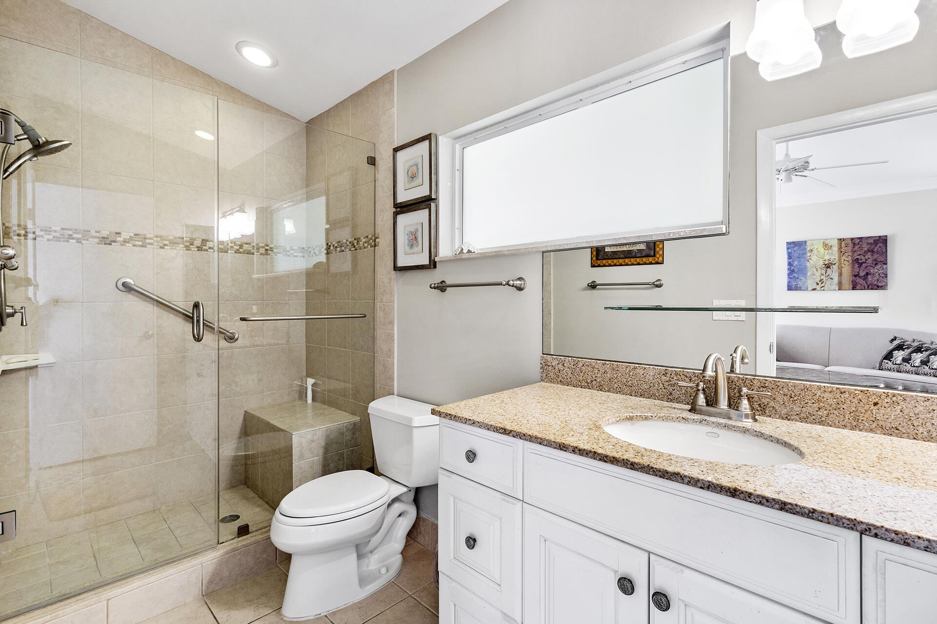 2530 Northwest 40th Street Boca Raton, FL 33434 - Photo 23 of 35 a bathroom with a granite countertop sink toilet and shower