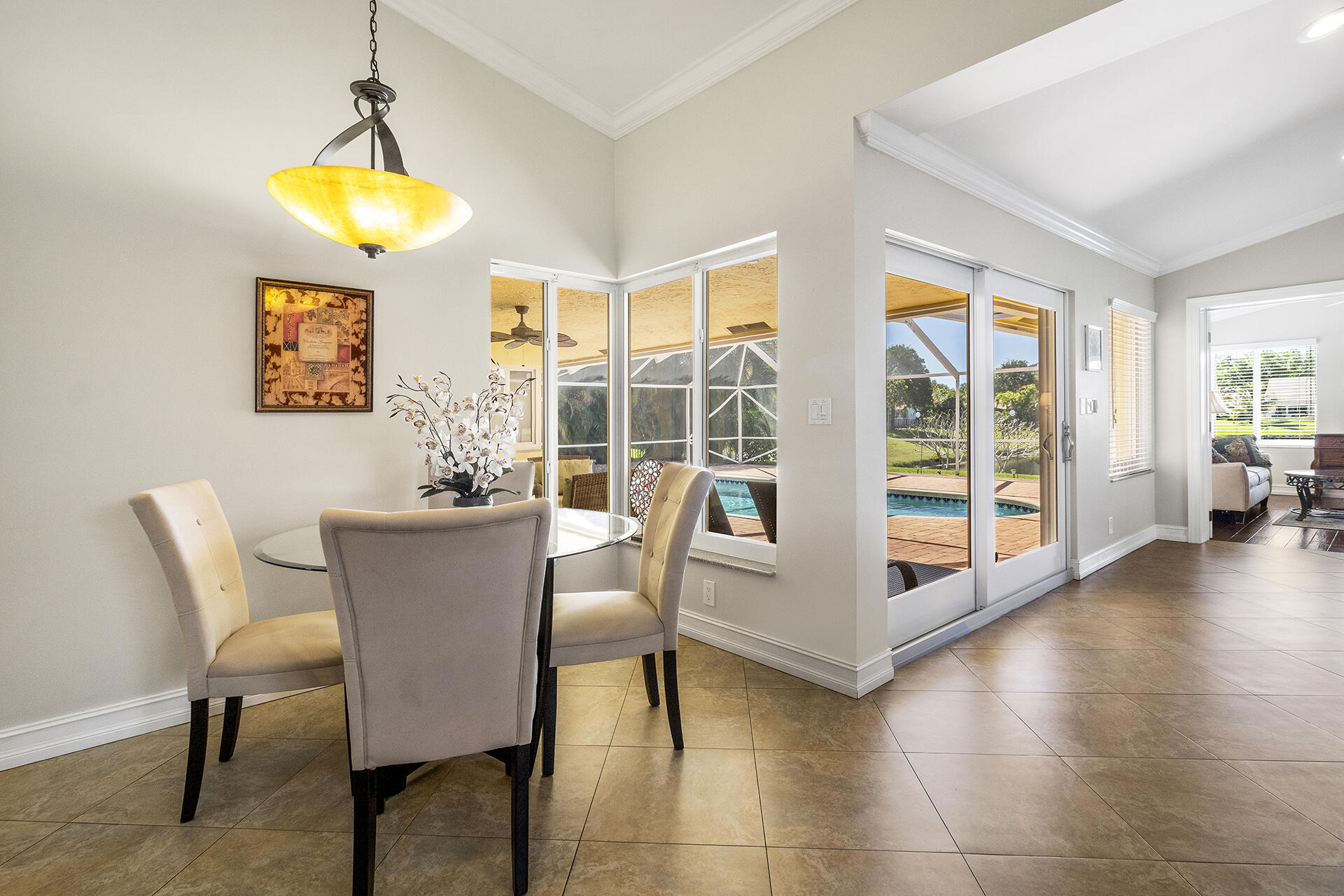 2530 Northwest 40th Street Boca Raton, FL 33434 - Photo 5 of 35 a view of a dining room with furniture and chandelier
