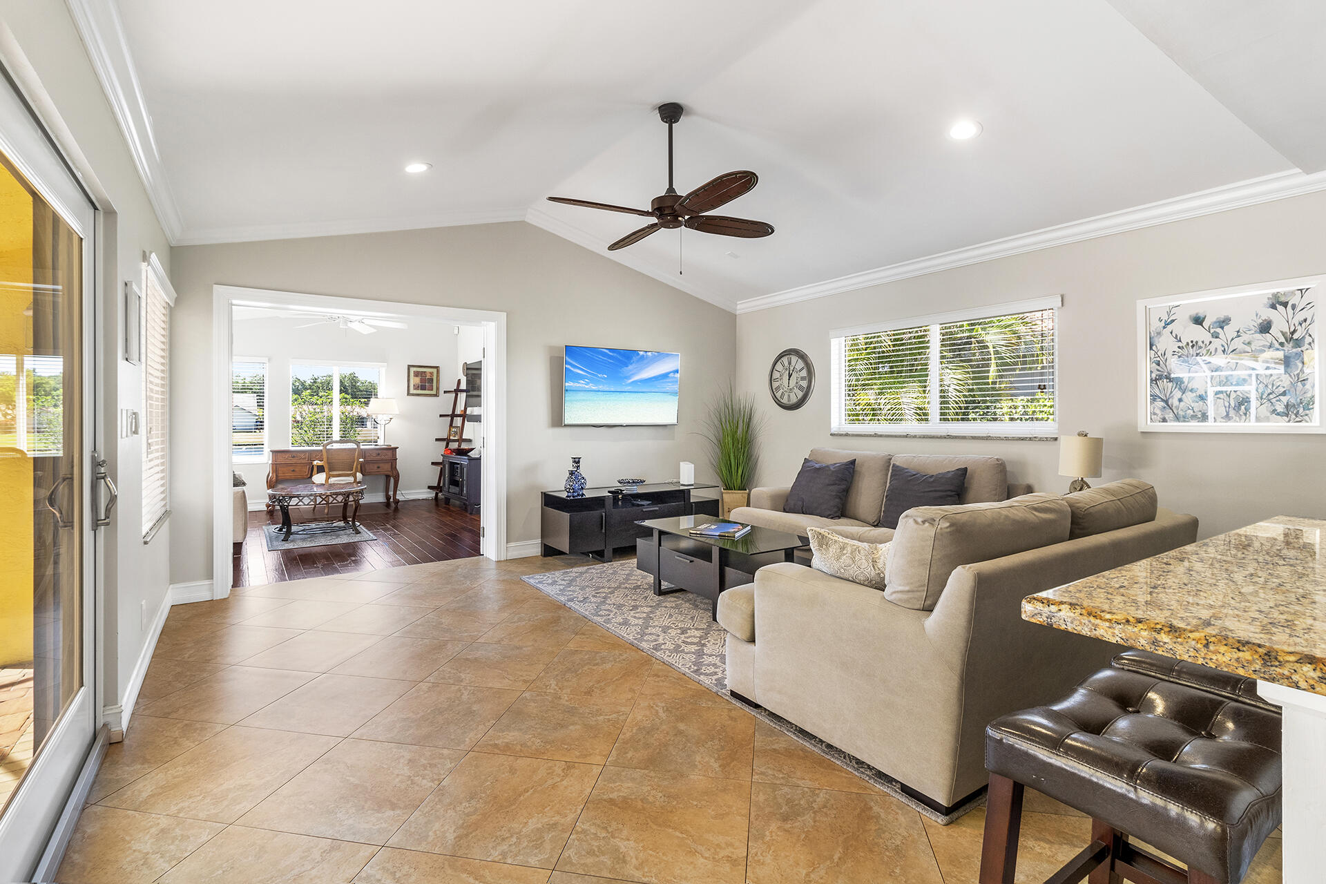 2530 Northwest 40th Street Boca Raton, FL 33434 - Photo 7 of 35 a living room with furniture and a chandelier