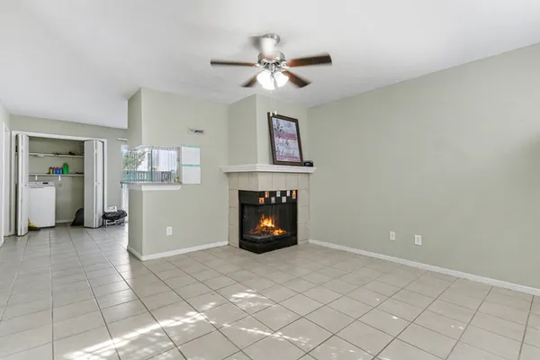 a view of an empty room with a fireplace