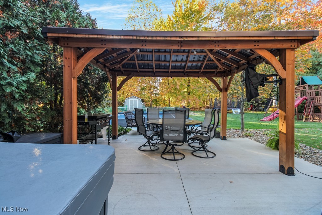 132 Timber Ridge Drive, Unit RDR Elyria, OH 44035 - Photo 35 of 41 View of patio / terrace featuring a gazebo, a playground, and a storage shed