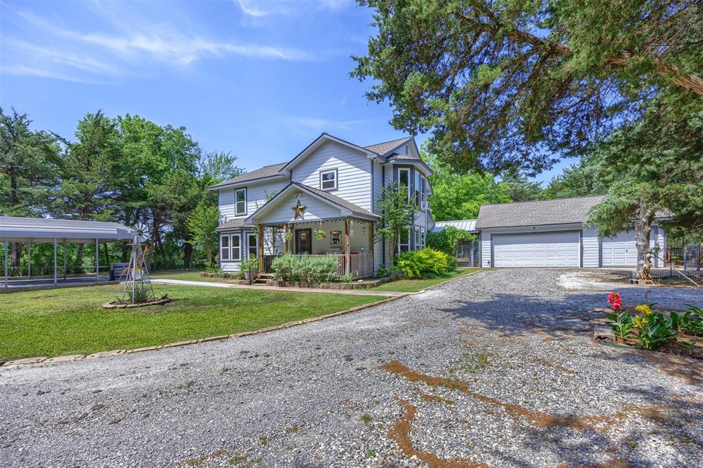 881 Wild Road Van Alstyne, TX 75495 - Photo 2 of 40 a front view of a house with garden