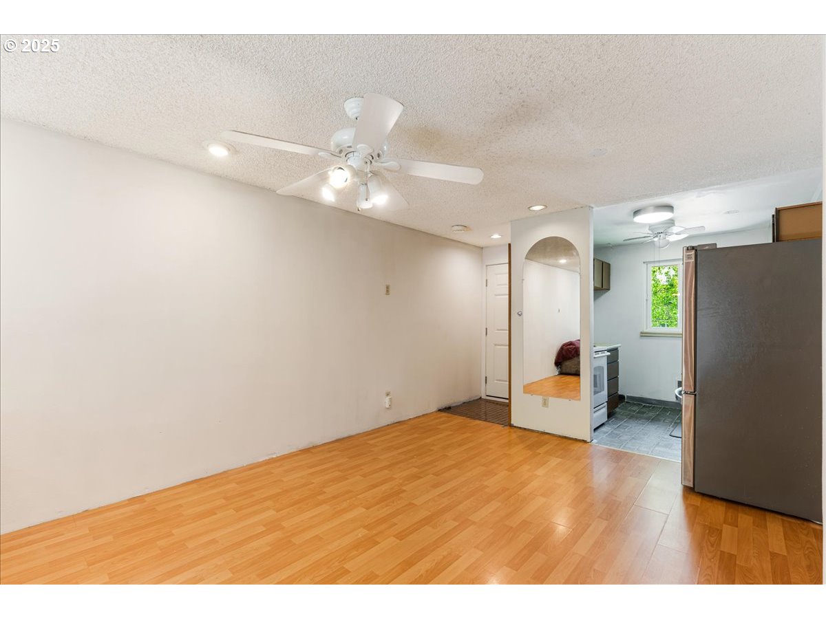 12620 Northwest Barnes Road, Unit 5 Portland, OR 97229 - Photo 11 of 26 a view of an empty room with a window