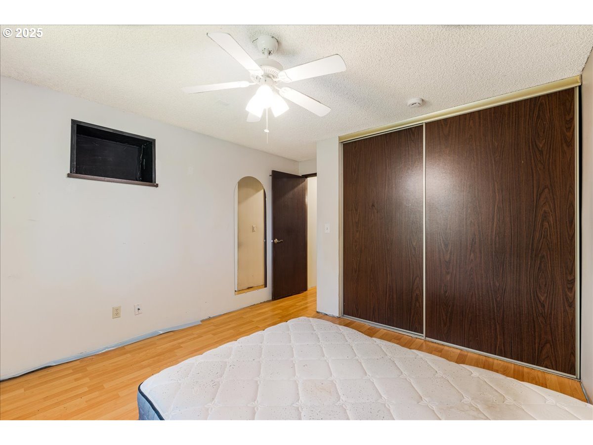12620 Northwest Barnes Road, Unit 5 Portland, OR 97229 - Photo 17 of 26 a view of an empty room with wooden floor