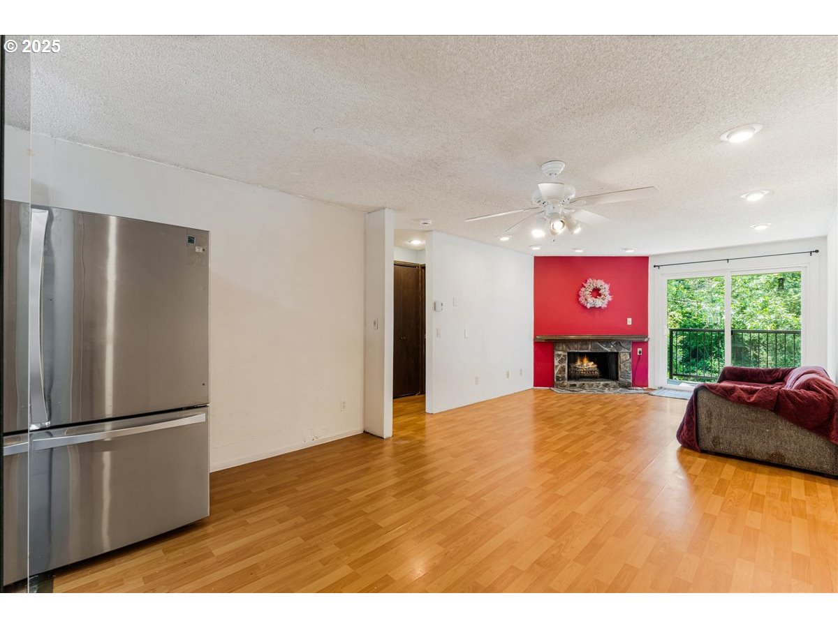 12620 Northwest Barnes Road, Unit 5 Portland, OR 97229 - Photo 4 of 26 a view of a room with furniture and a window