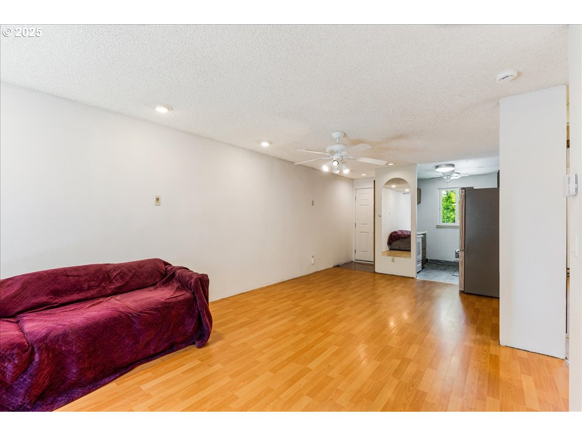 12620 Northwest Barnes Road, Unit 5 Portland, OR 97229 - Photo 6 of 26 a view of an empty room with a window