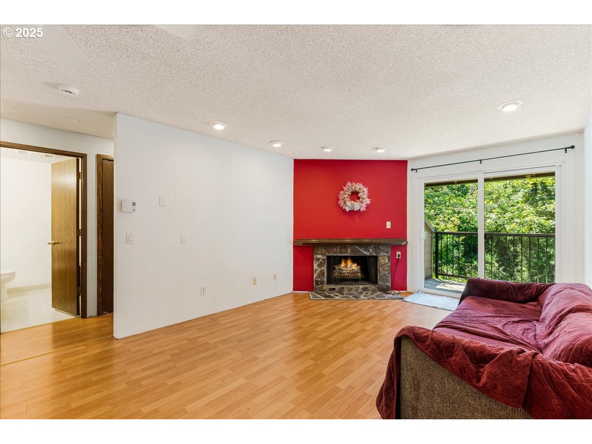 12620 Northwest Barnes Road, Unit 5 Portland, OR 97229 - Photo 8 of 26 a view of livingroom with furniture fireplace and window