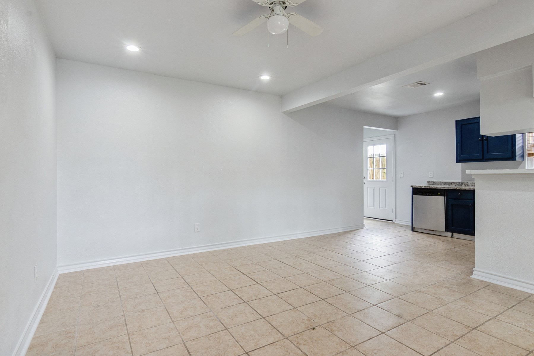 4505 Cochran Street Houston, TX 77009 - Photo 3 of 25 a view of an empty room and a kitchen