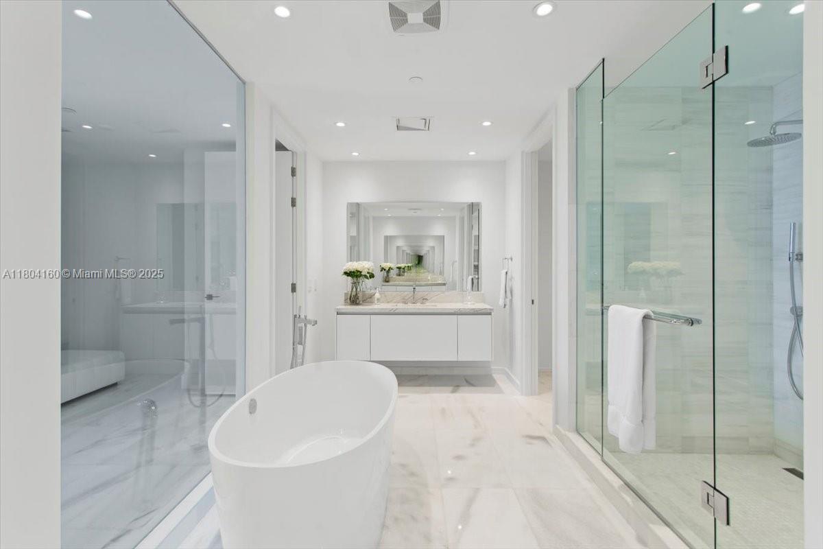 700 Northeast 26th Terrace, Unit 3903 Miami, FL 33137 - Photo 17 of 42 a bathroom with a sink a toilet and shower