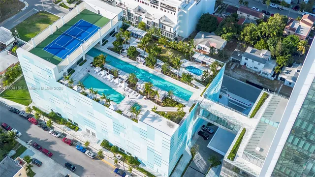 a view of swimming pool with outdoor seating and plants