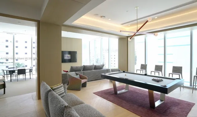 a room with lots of table chair and a view of living room