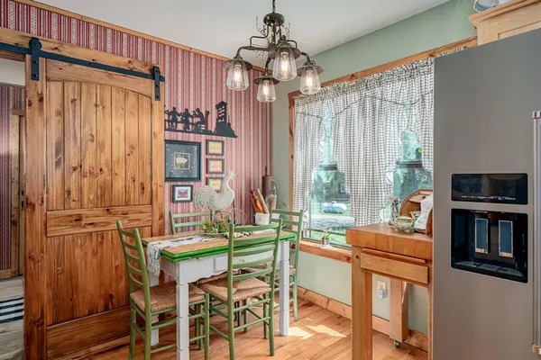 a dining room with furniture and window