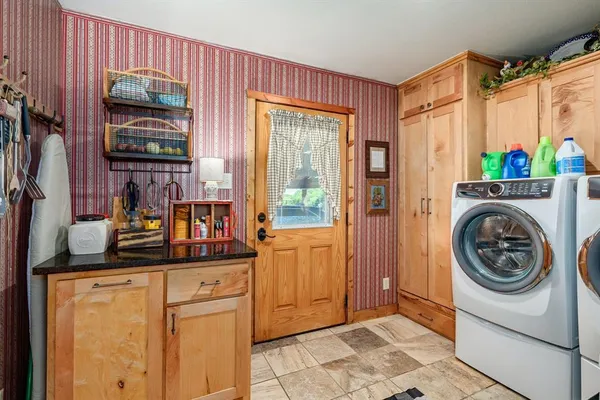 a kitchen with stainless steel appliances a refrigerator and a stove