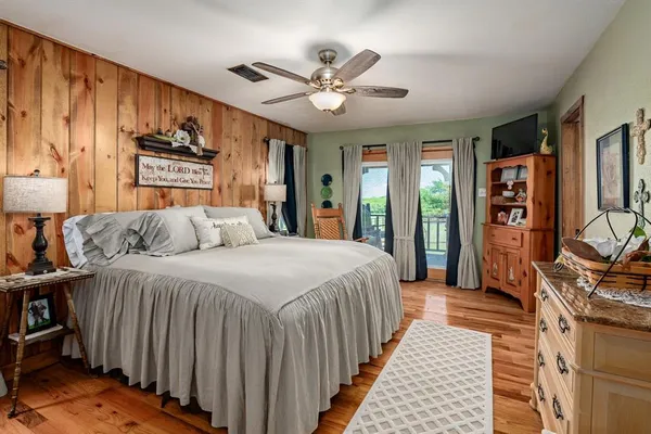 a spacious bedroom with a bed and a walk in closet