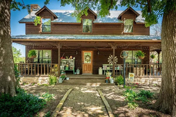 a front view of a house with a porch