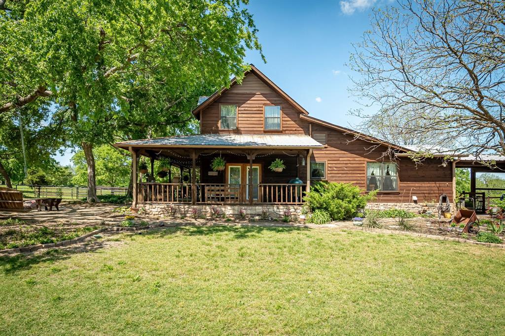 14392 Highway 78 Blue Ridge, TX 75424 - Photo 3 of 40 a front view of a house with garden