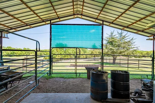 a view of a house with a backyard and a patio