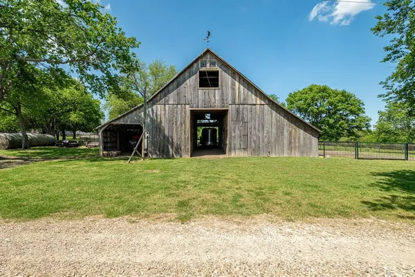 an aerial view of a golf course with houses