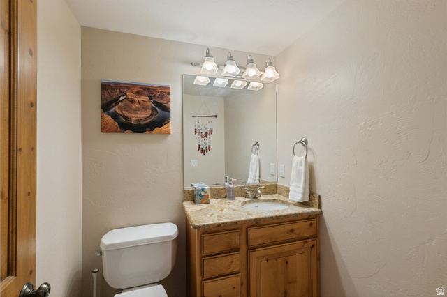 755 South Zion Ridge Drive Orderville, UT 84758 - Photo 32 of 84 Half bath featuring a textured wall and vanity