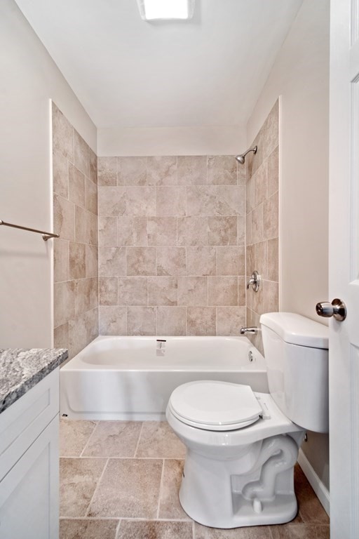 416 Nottingham Street Springfield, MA 01104 - Photo 13 of 20 a bathroom with a toilet and a bathtub