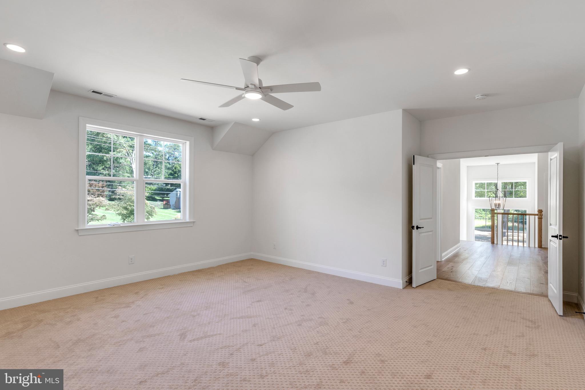 736 Northbrook Road, Unit S4 Kennett Square, PA 19348 - Photo 14 of 45 a view of a livingroom with a ceiling fan and window