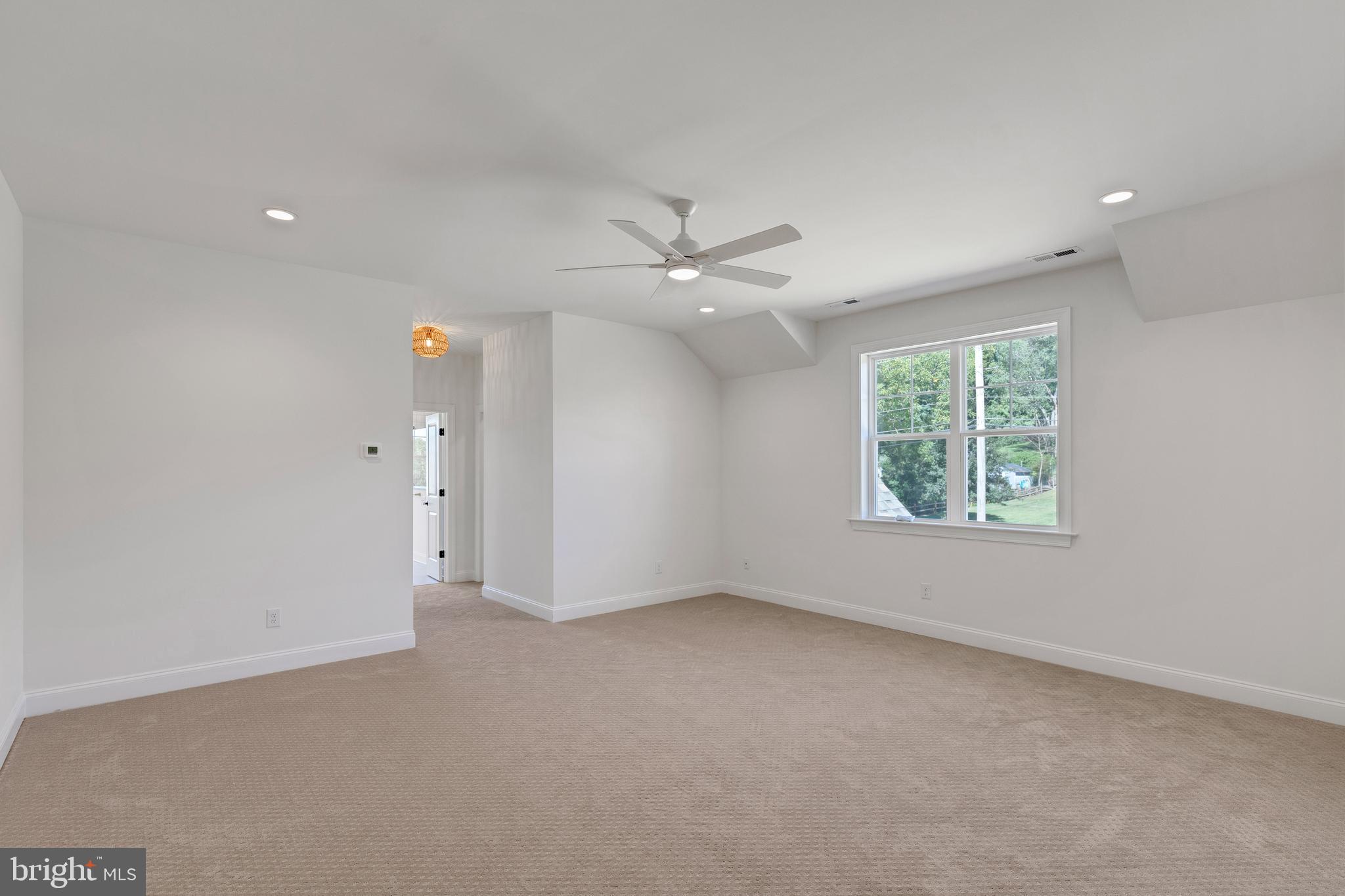 736 Northbrook Road, Unit S4 Kennett Square, PA 19348 - Photo 15 of 45 an empty room with windows and fan
