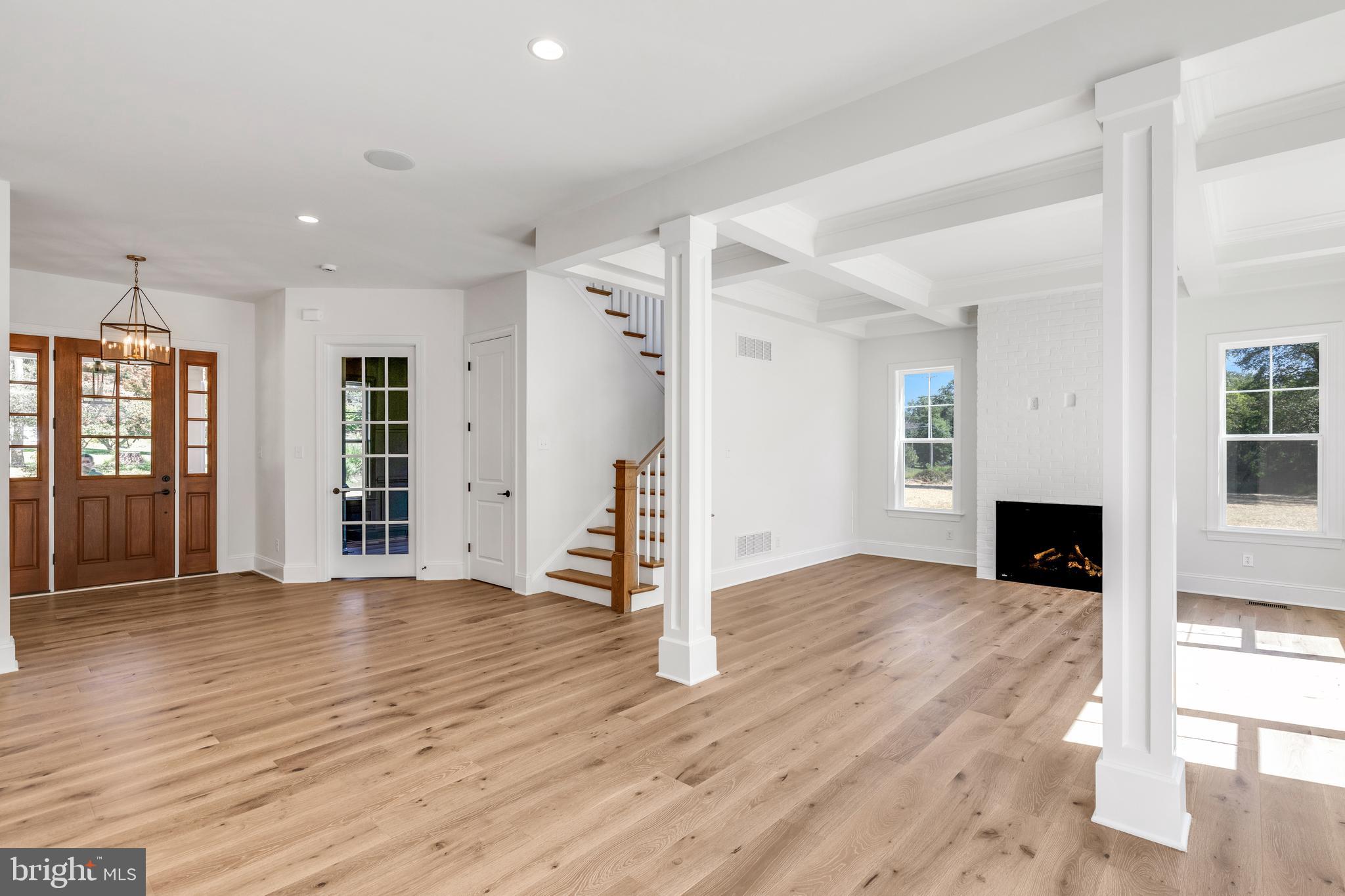 736 Northbrook Road, Unit S4 Kennett Square, PA 19348 - Photo 6 of 45 a view of a livingroom with wooden floor and staircase