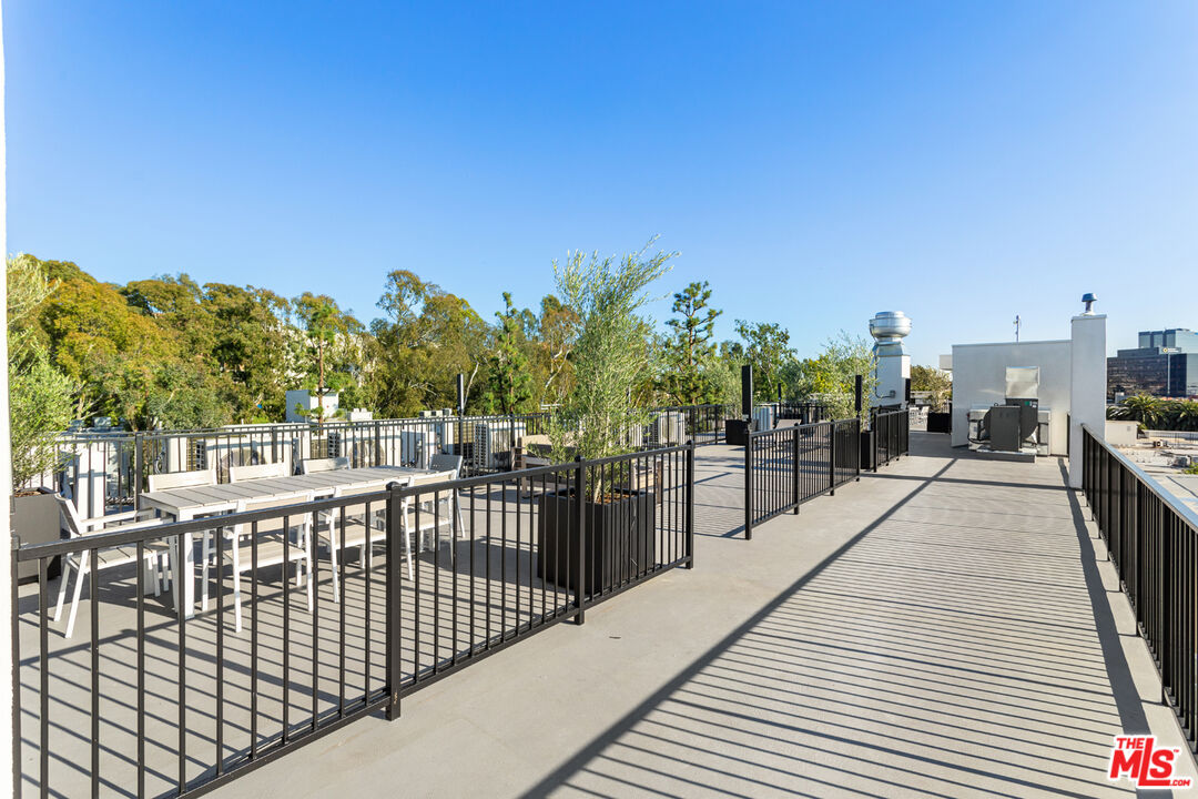 11620 Chenault Street, Unit 103 Los Angeles, CA 90049 - Photo 21 of 21 a view of a balcony with city view