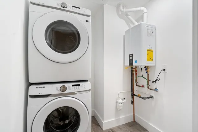 a view of a hallway with washer and dryer