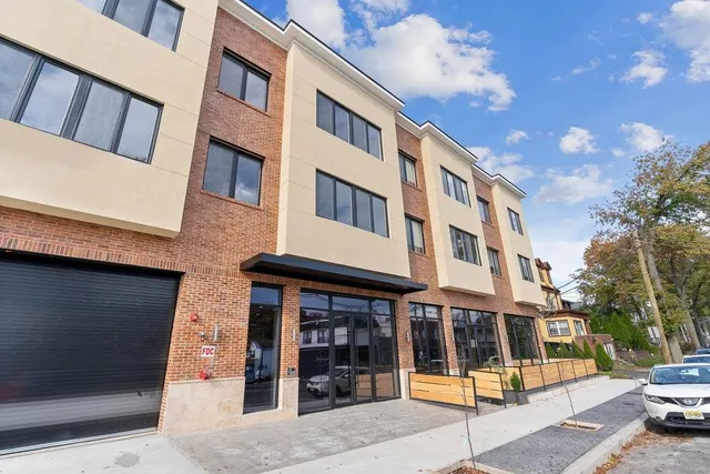 a front view of a building with street